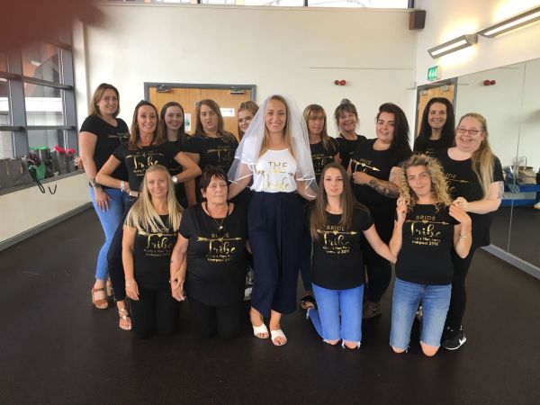 Group of women performing iconic Britney choreography at hen party dance class in Manchester studio