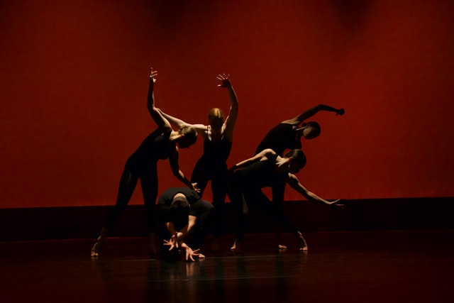 Group of women performing dynamic commercial dance choreography at hen party dance class in Manchester studio with professional mirrors